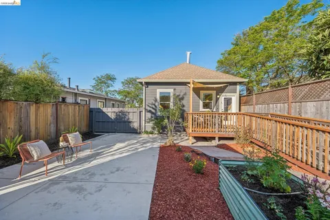 a view of a backyard with sitting area