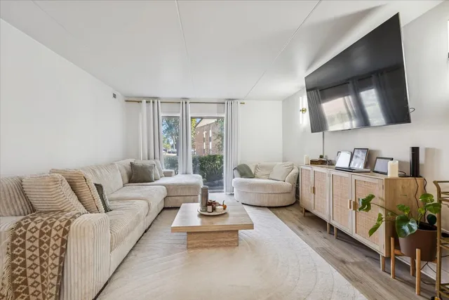 a living room with furniture and flat screen tv