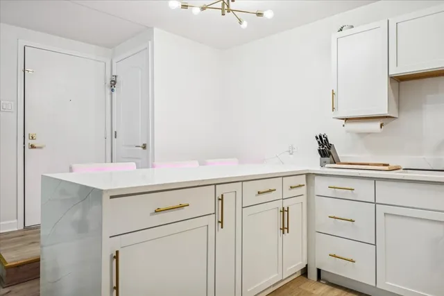 a kitchen with cabinets and white appliances
