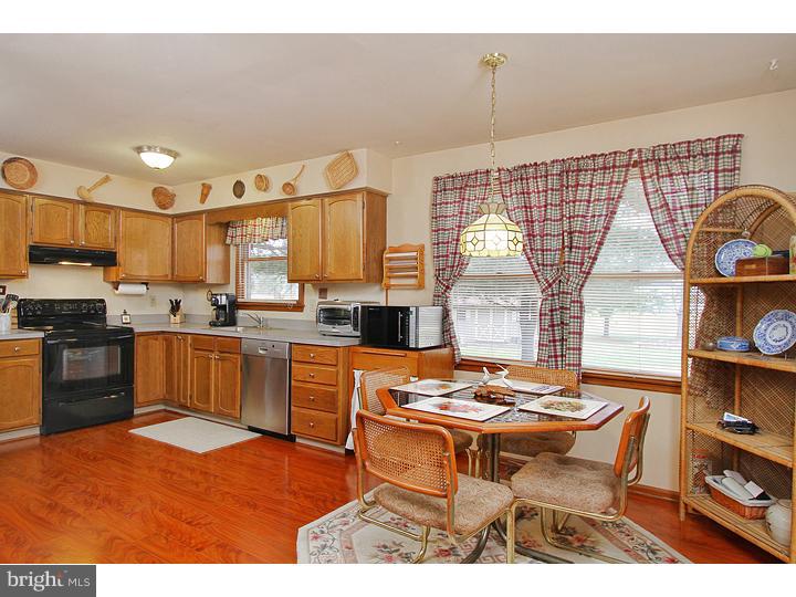 739 Rattling Run Road Mickleton, NJ 08056 - Photo 3 of 19 a open kitchen with stainless steel appliances kitchen island granite countertop a sink and cabinets