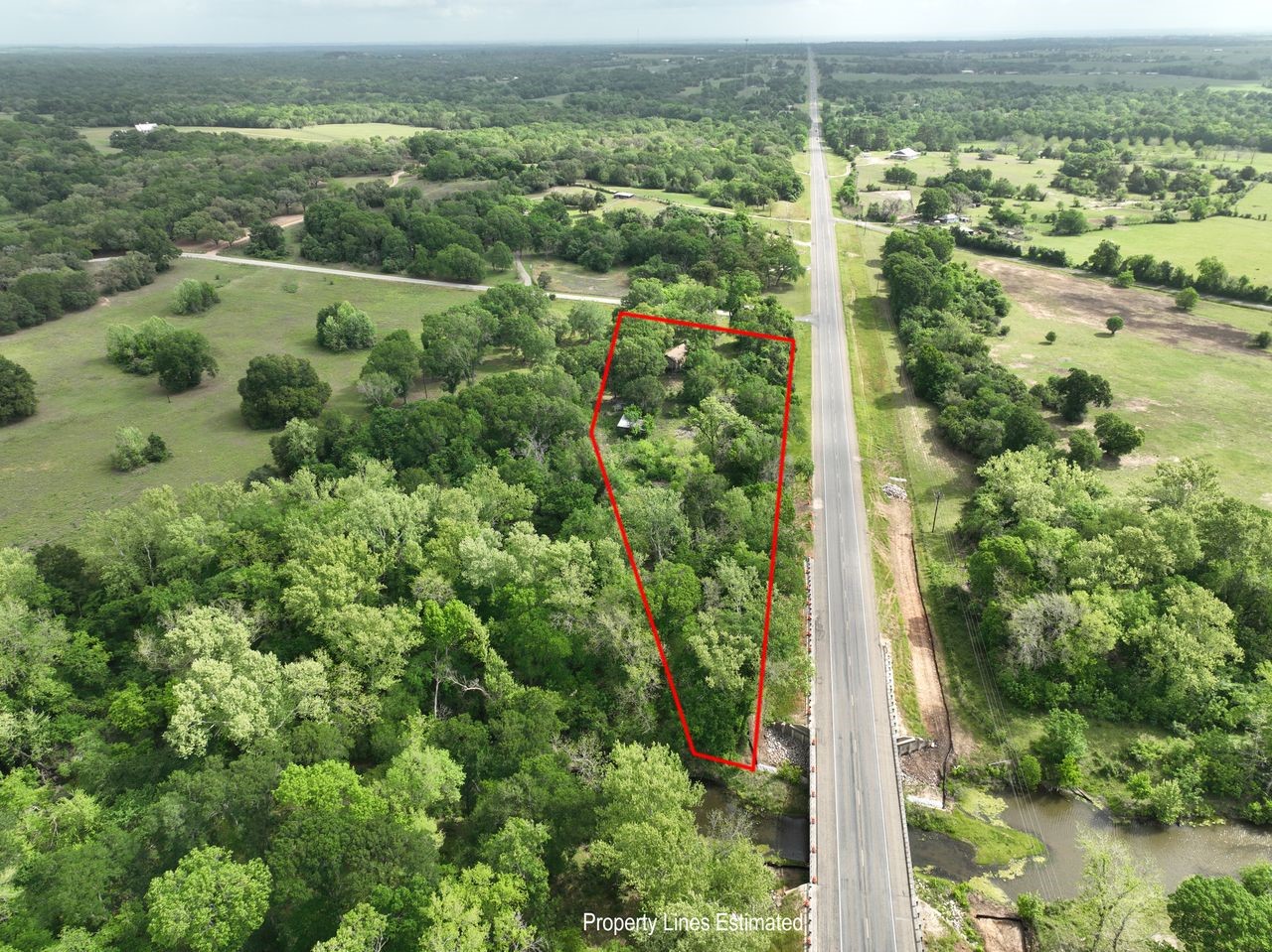 4321 Gaskamp Road Washington, TX 77880 - Photo 3 of 9 an aerial view of residential houses with outdoor space and trees