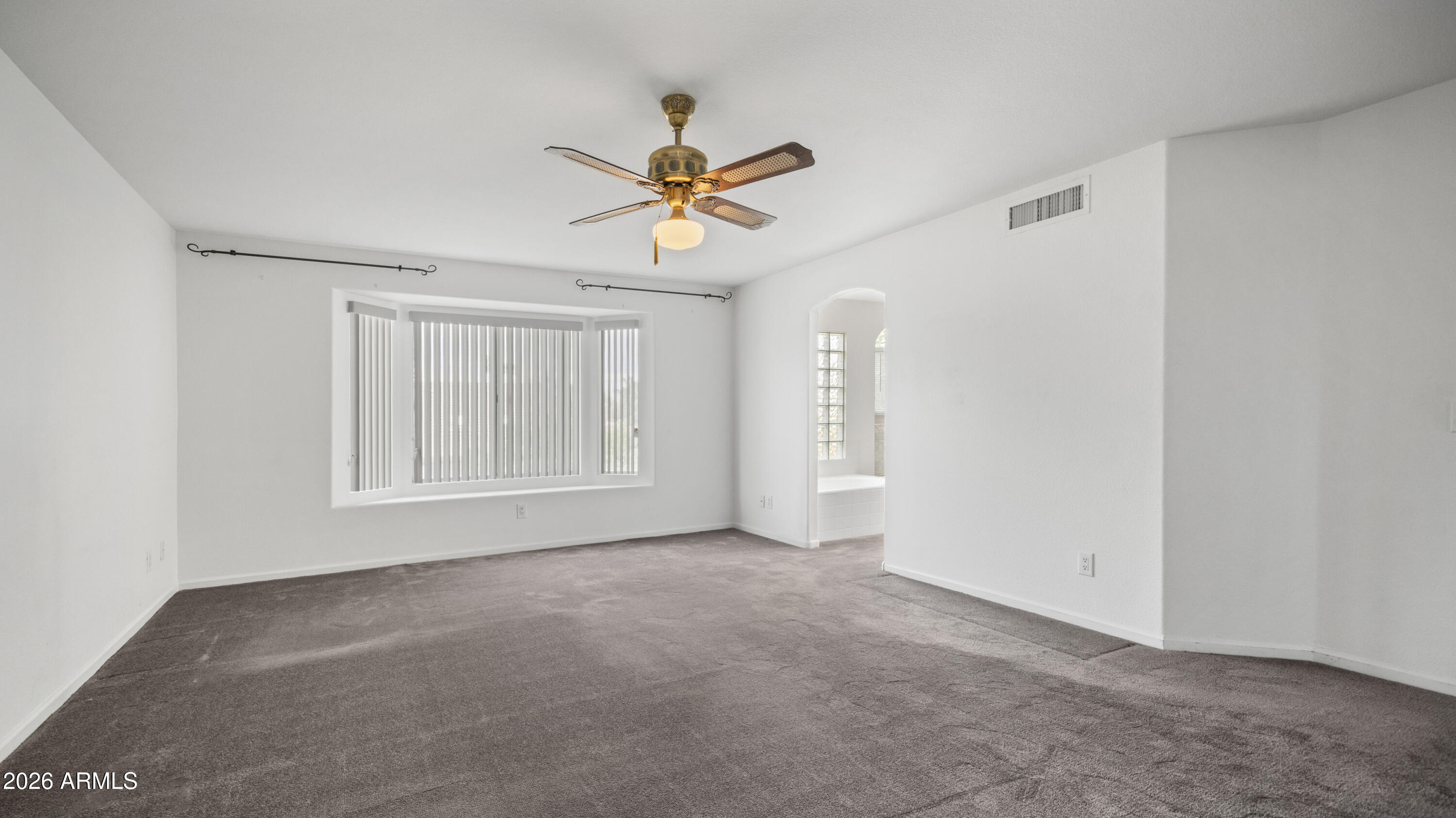 6620 West Redfield Road Glendale, AZ 85306 - Photo 30 of 33 a view of a livingroom with a ceiling fan and window