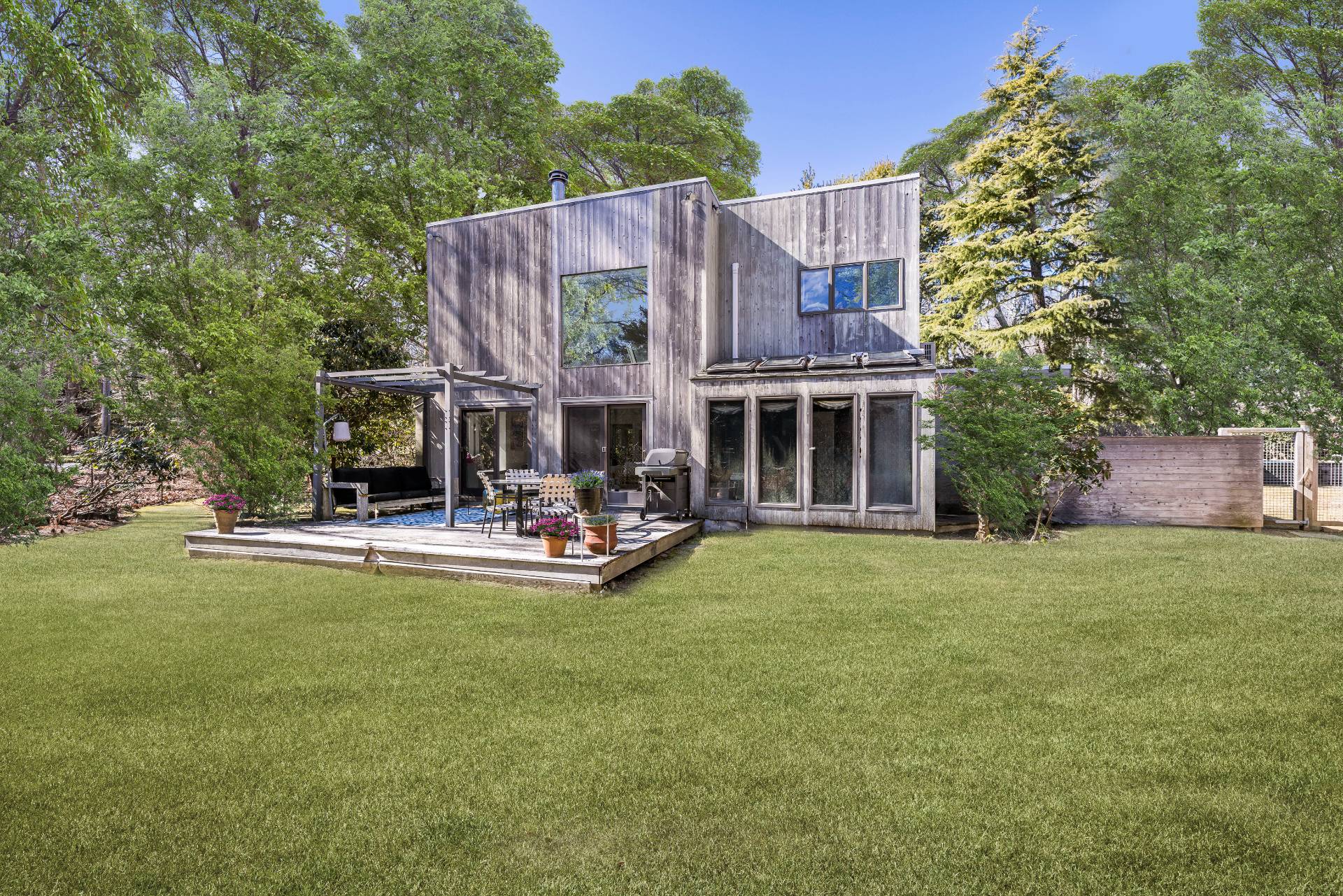 33 Robins Way East Hampton, NY 11937 - Photo 2 of 18 a view of a house with swimming pool and porch