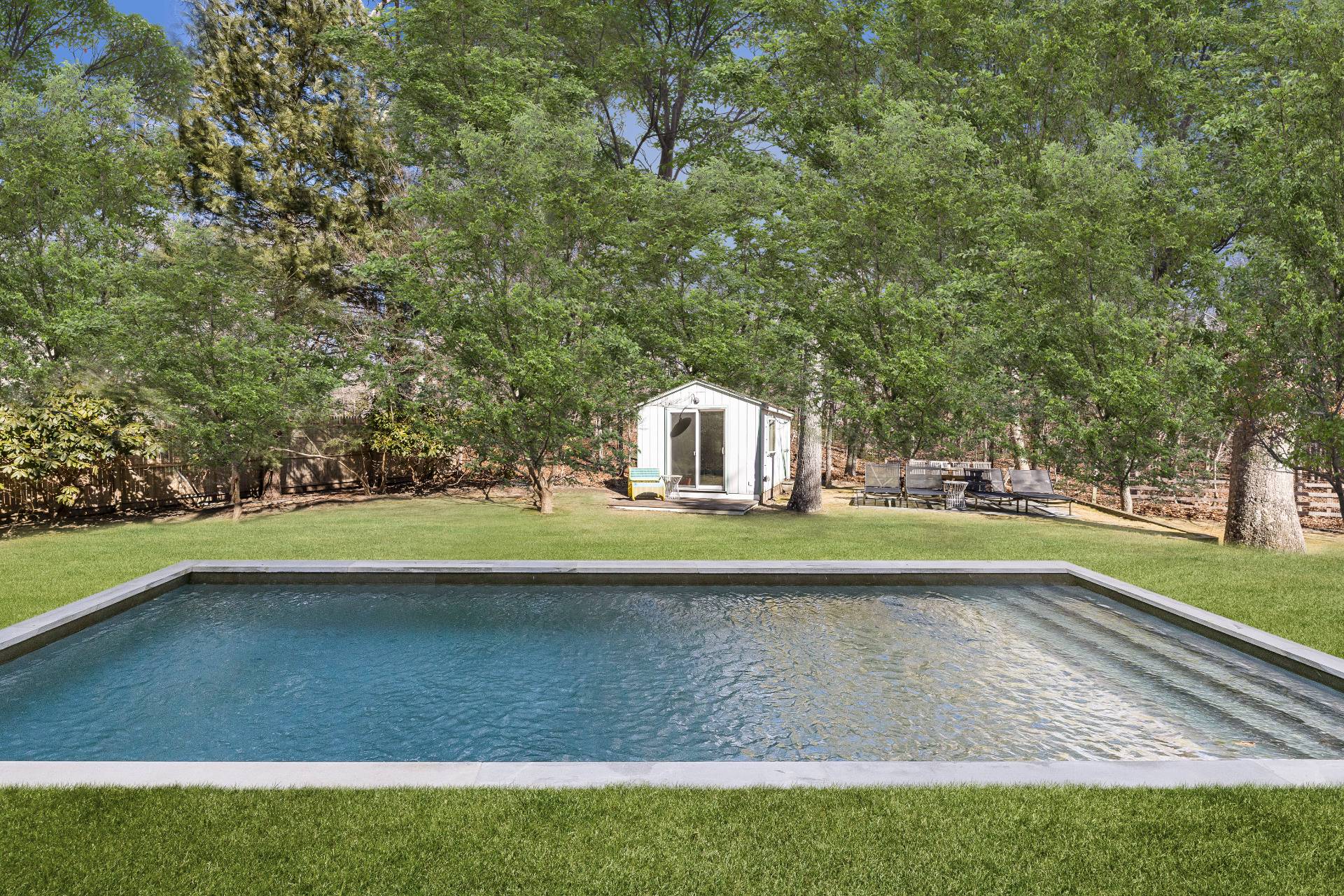 33 Robins Way East Hampton, NY 11937 - Photo 3 of 18 a view of a swimming pool with an outdoor space