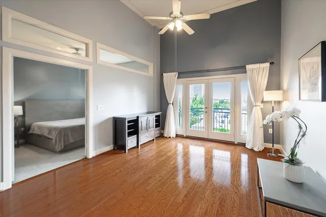 a view of a livingroom with furniture hardwood floor and workspace