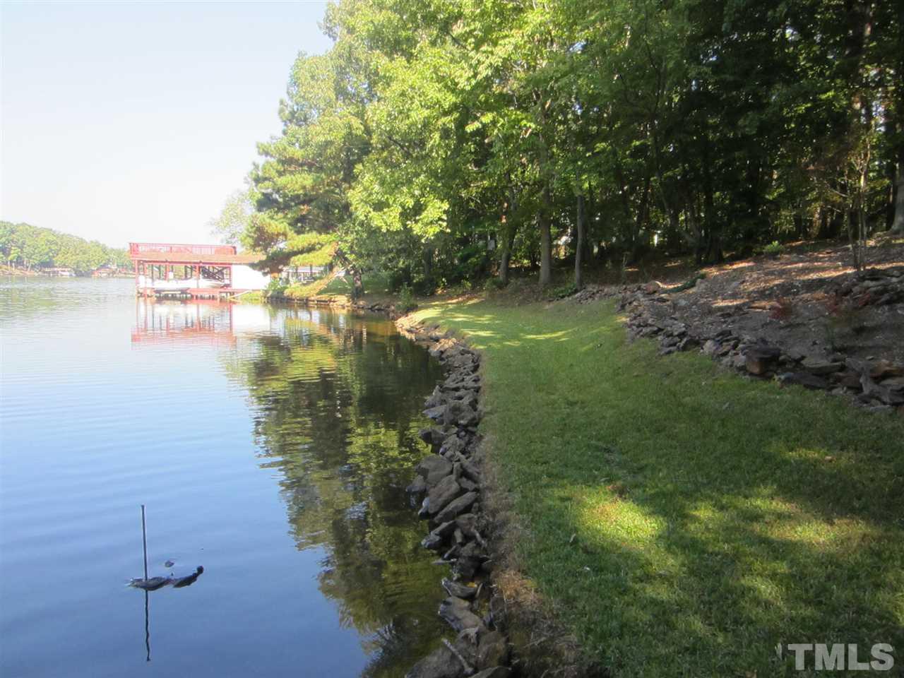 a view of lake with green space