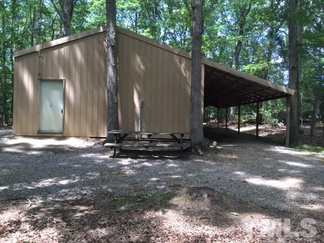 0 Lynch Point Road Macon, NC 27551 - Photo 8 of 8 a view of a house with backyard and sitting area