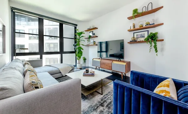 a living room with furniture and a flat screen tv