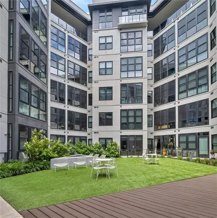 a view of a building with a yard