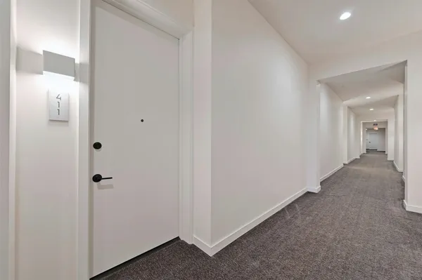 a view of a hallway with closet