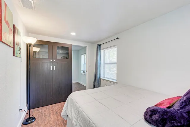 a bedroom with a bed and a closet