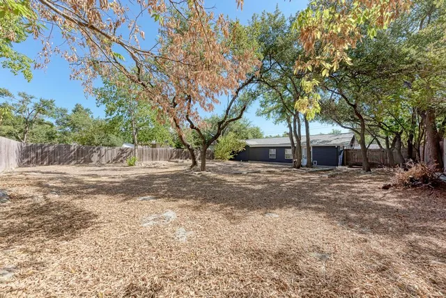 a backyard of a house with lots of green space