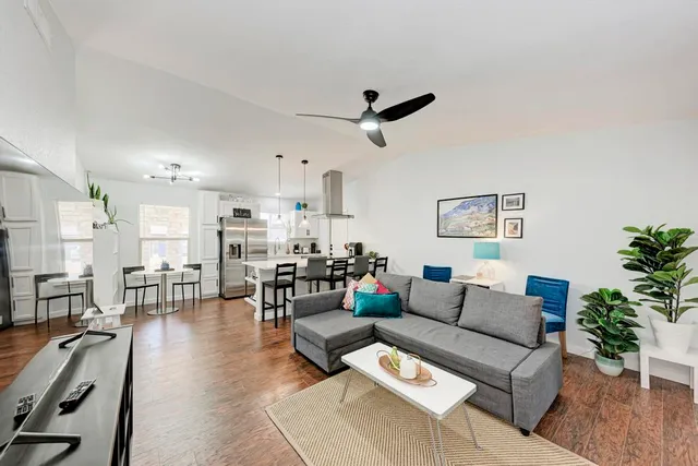 a living room with furniture and a large window