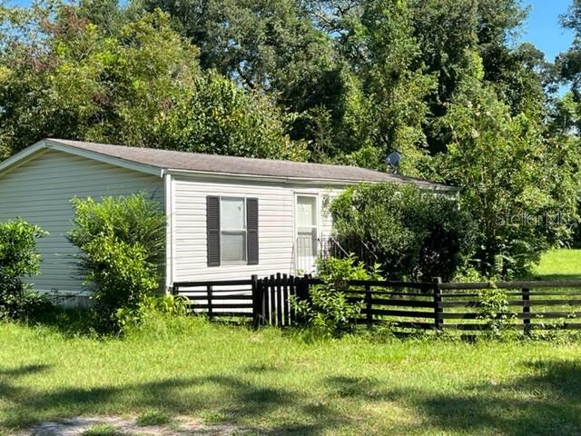 26304 Southwest 2nd Avenue Newberry, FL 32669 - Photo 1 of 1 a view of a house with a yard