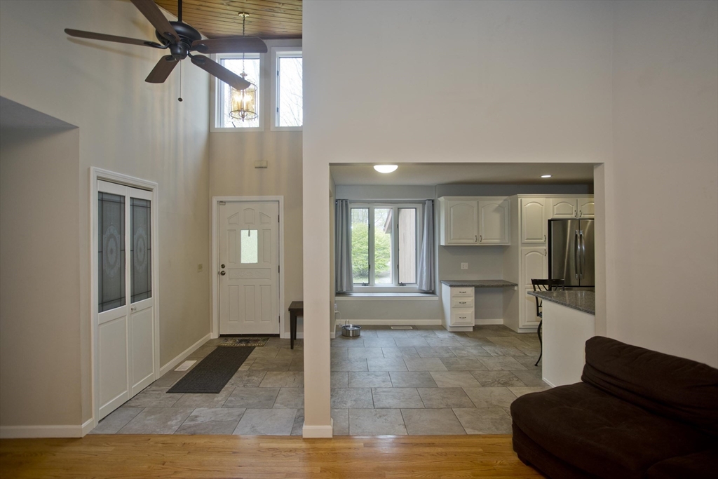 32 Zuell Hill Road Monson, MA 01057 - Photo 11 of 37 a living room with furniture and a fireplace
