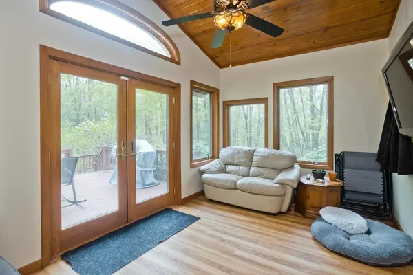 a living room with furniture and a large window