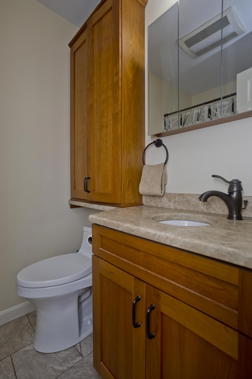 32 Zuell Hill Road Monson, MA 01057 - Photo 17 of 37 a bathroom with a sink a toilet and vanity
