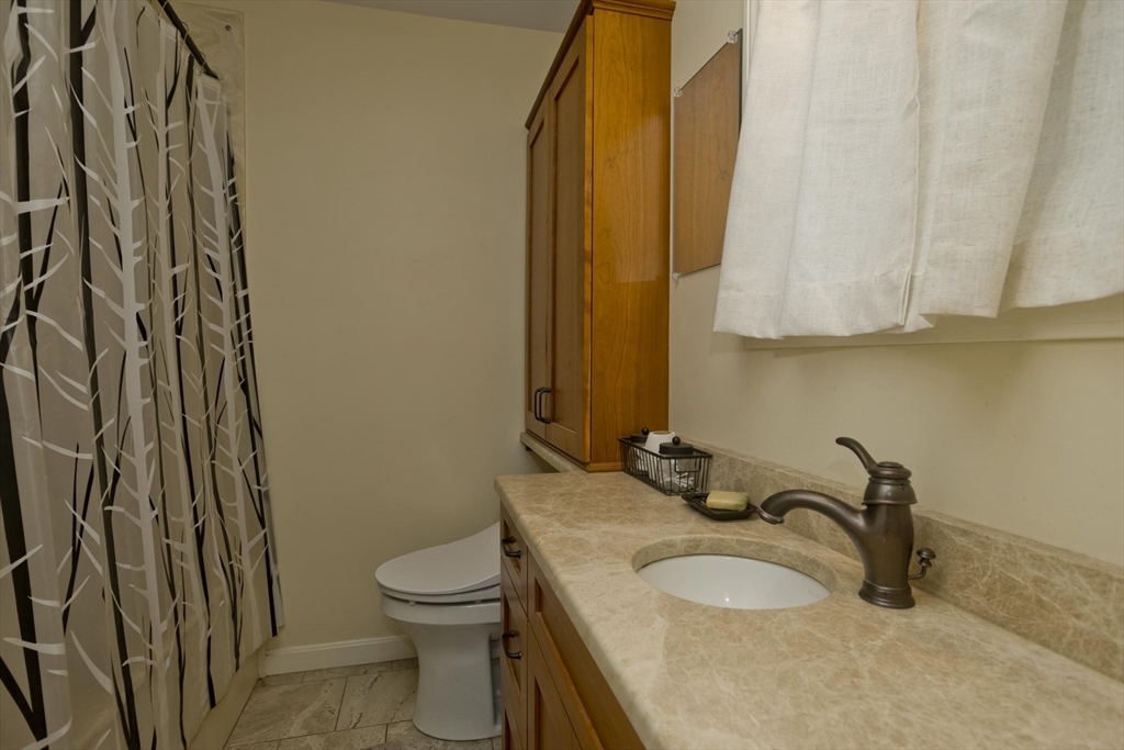 32 Zuell Hill Road Monson, MA 01057 - Photo 20 of 37 a bathroom with a granite countertop sink and a mirror