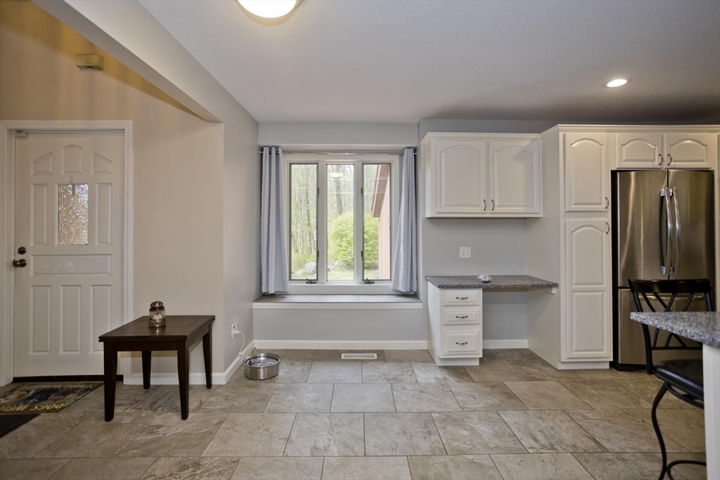 32 Zuell Hill Road Monson, MA 01057 - Photo 2 of 37 a kitchen with a refrigerator a stove a sink and a cabinets