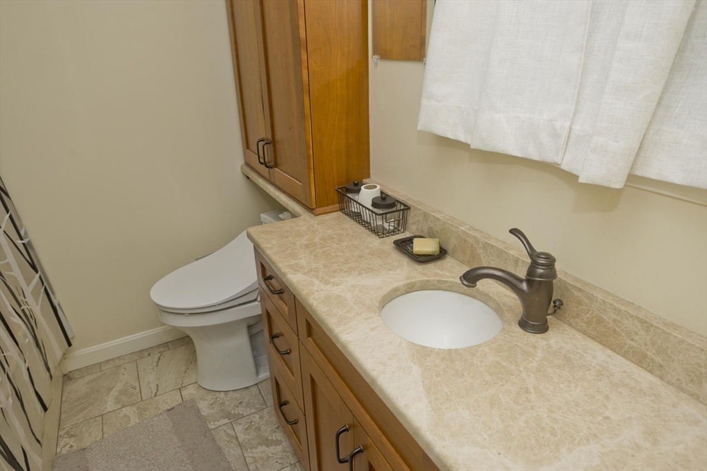 32 Zuell Hill Road Monson, MA 01057 - Photo 21 of 37 a bathroom with a granite countertop sink and a toilet
