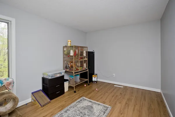 a view of workspace with furniture and wooden floor