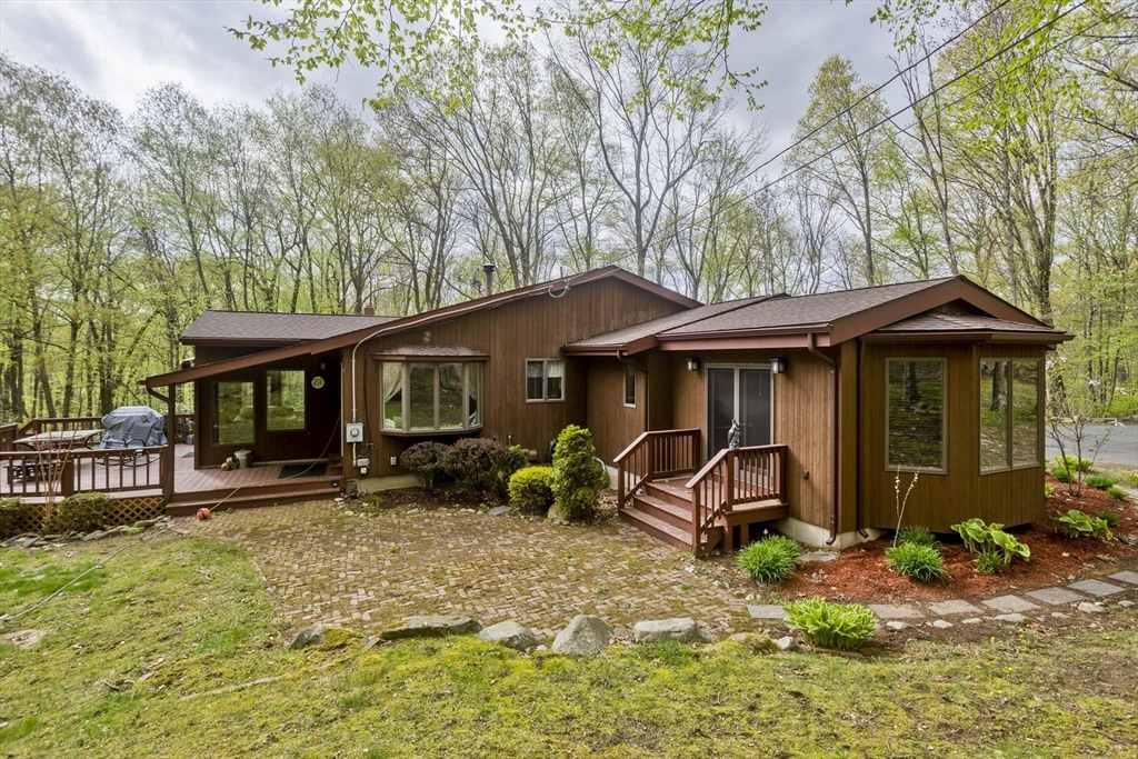 32 Zuell Hill Road Monson, MA 01057 - Photo 28 of 37 a view of a house with a yard and sitting area