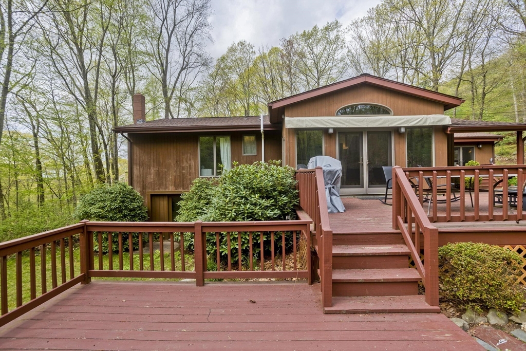 32 Zuell Hill Road Monson, MA 01057 - Photo 29 of 37 a view of a house with wooden deck and furniture