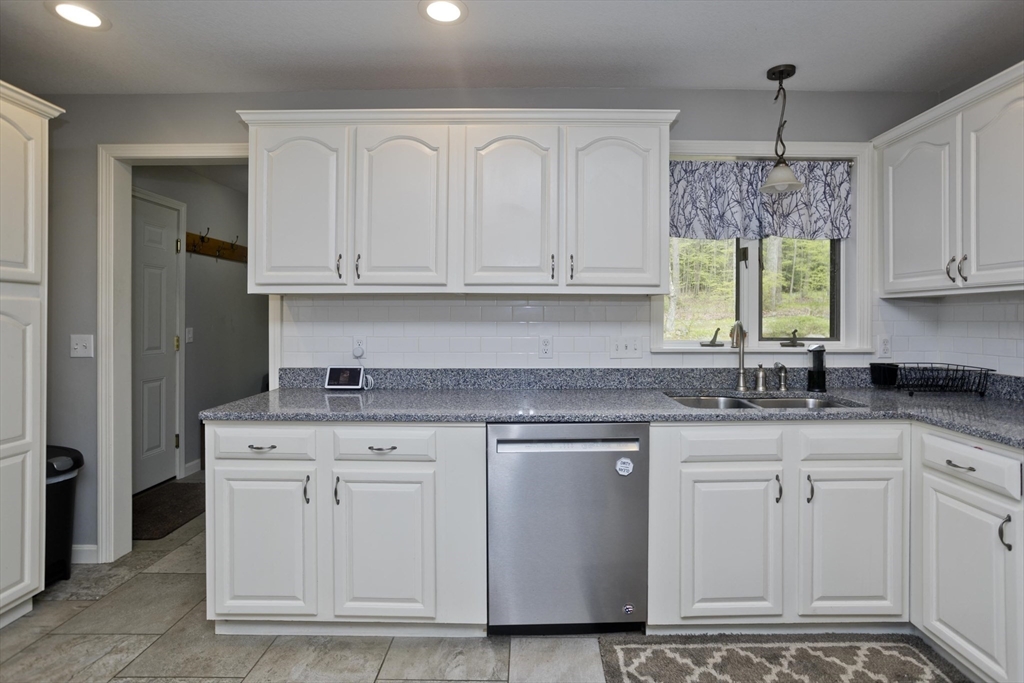 32 Zuell Hill Road Monson, MA 01057 - Photo 6 of 37 a kitchen with stainless steel appliances granite countertop a sink cabinets and a window