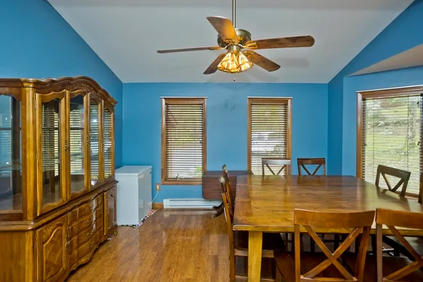 a dining room with furniture and window