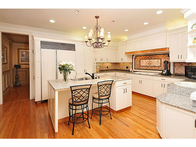 430 Fulton Road San Mateo, CA 94402 - Photo 13 of 25 a kitchen with stainless steel appliances granite countertop a kitchen island hardwood floor sink stove dining table and chairs