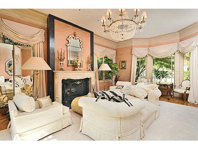430 Fulton Road San Mateo, CA 94402 - Photo 9 of 25 a living room with furniture a fireplace and a chandelier