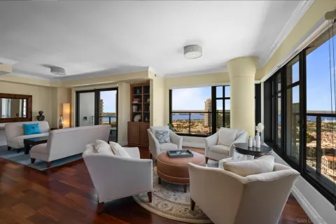 a living room with fireplace furniture and a wooden floor