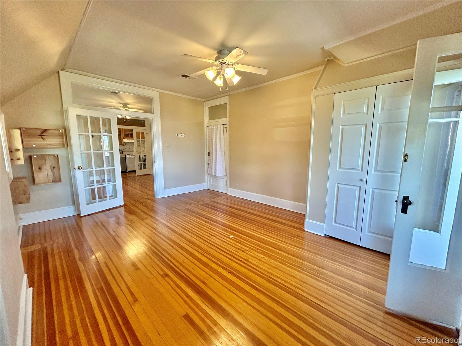 16-th 16-th E 16th Denver, CO 80203 - Photo 11 of 38 wooden floor in an empty room with a mirror