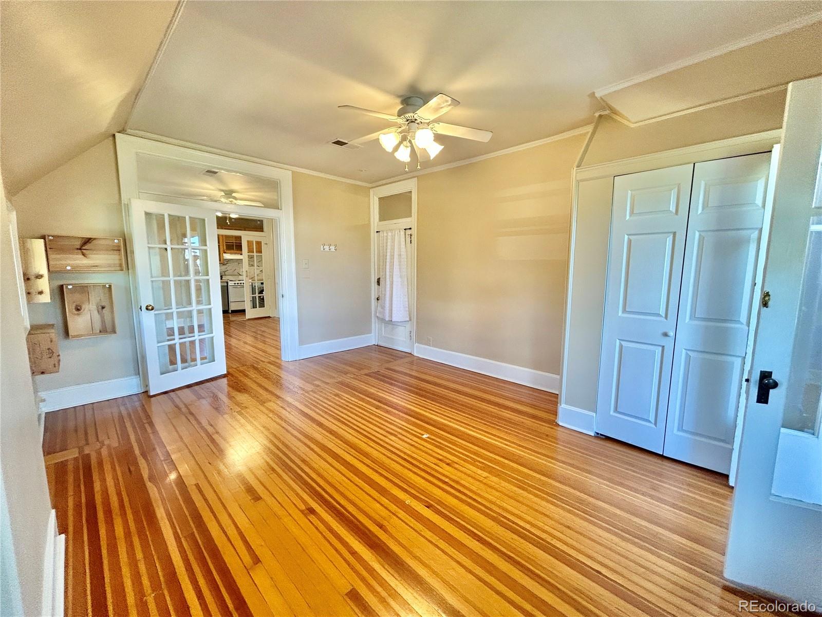 16-th 16-th E 16th Denver, CO 80203 - Photo 20 of 38 wooden floor in an empty room with a mirror