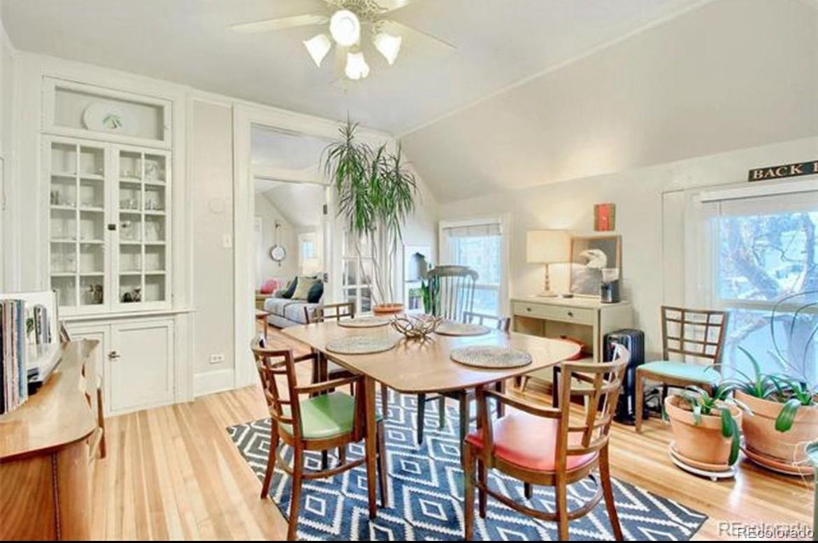 16-th 16-th E 16th Denver, CO 80203 - Photo 2 of 38 a view of a dining room with furniture wooden floor and chandelier