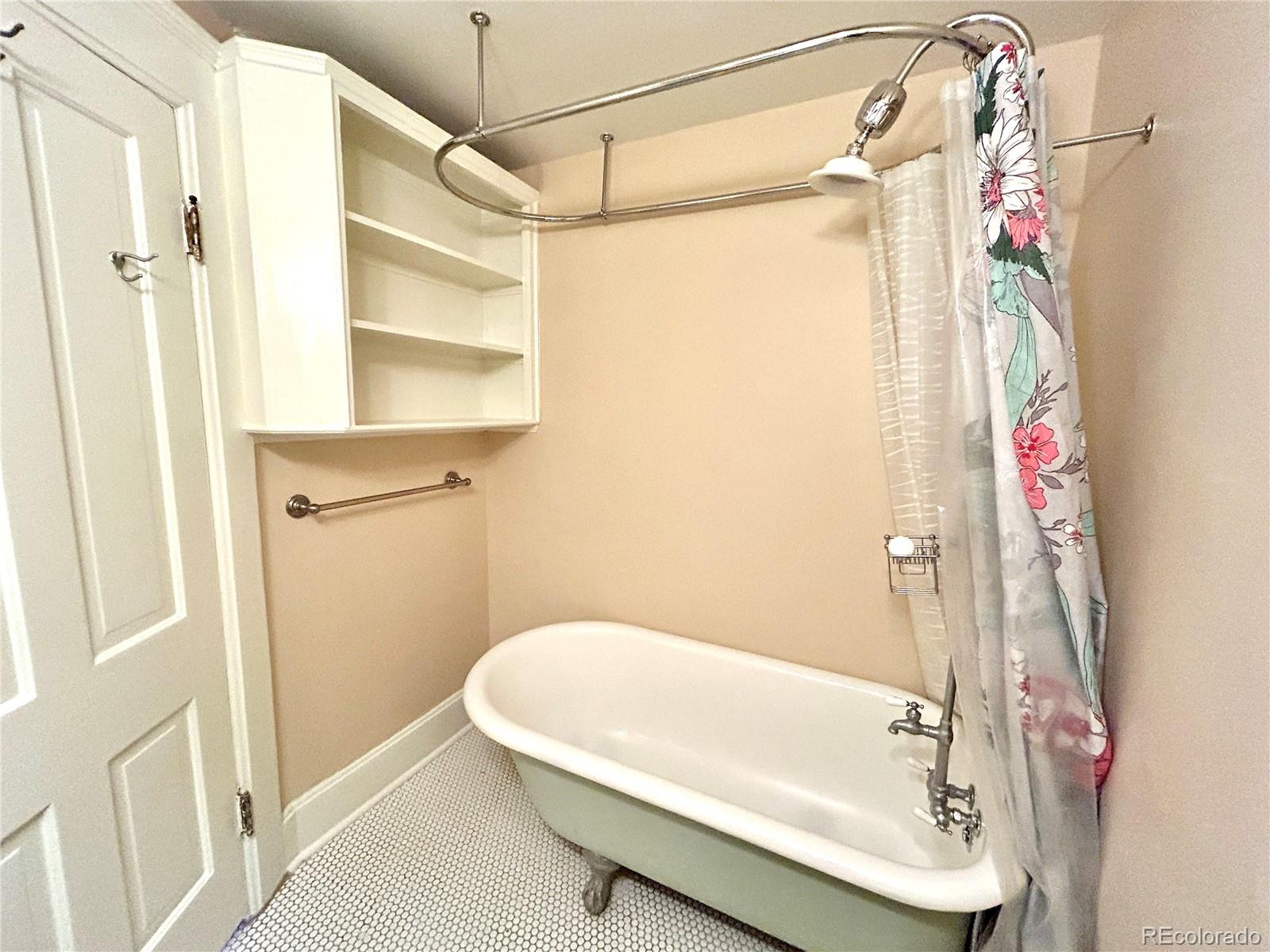 16-th 16-th E 16th Denver, CO 80203 - Photo 22 of 38 a bathroom with a tub and shower