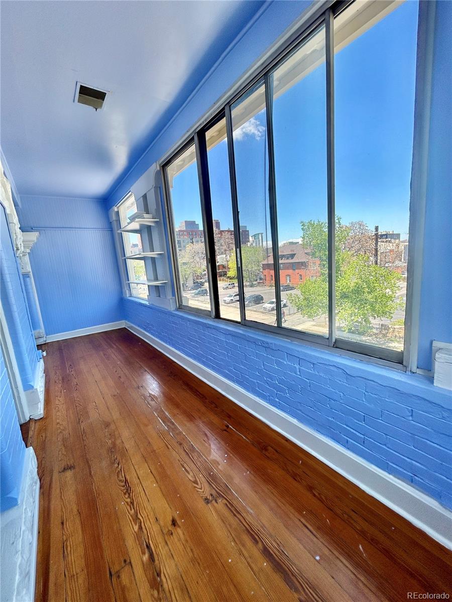 16-th 16-th E 16th Denver, CO 80203 - Photo 24 of 38 a view of empty room with wooden floor and fan