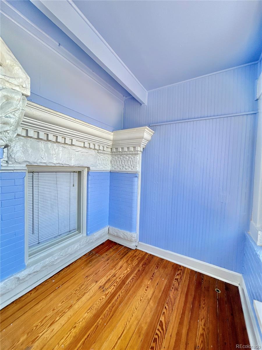 16-th 16-th E 16th Denver, CO 80203 - Photo 27 of 38 a view of empty room with wooden floor and fan