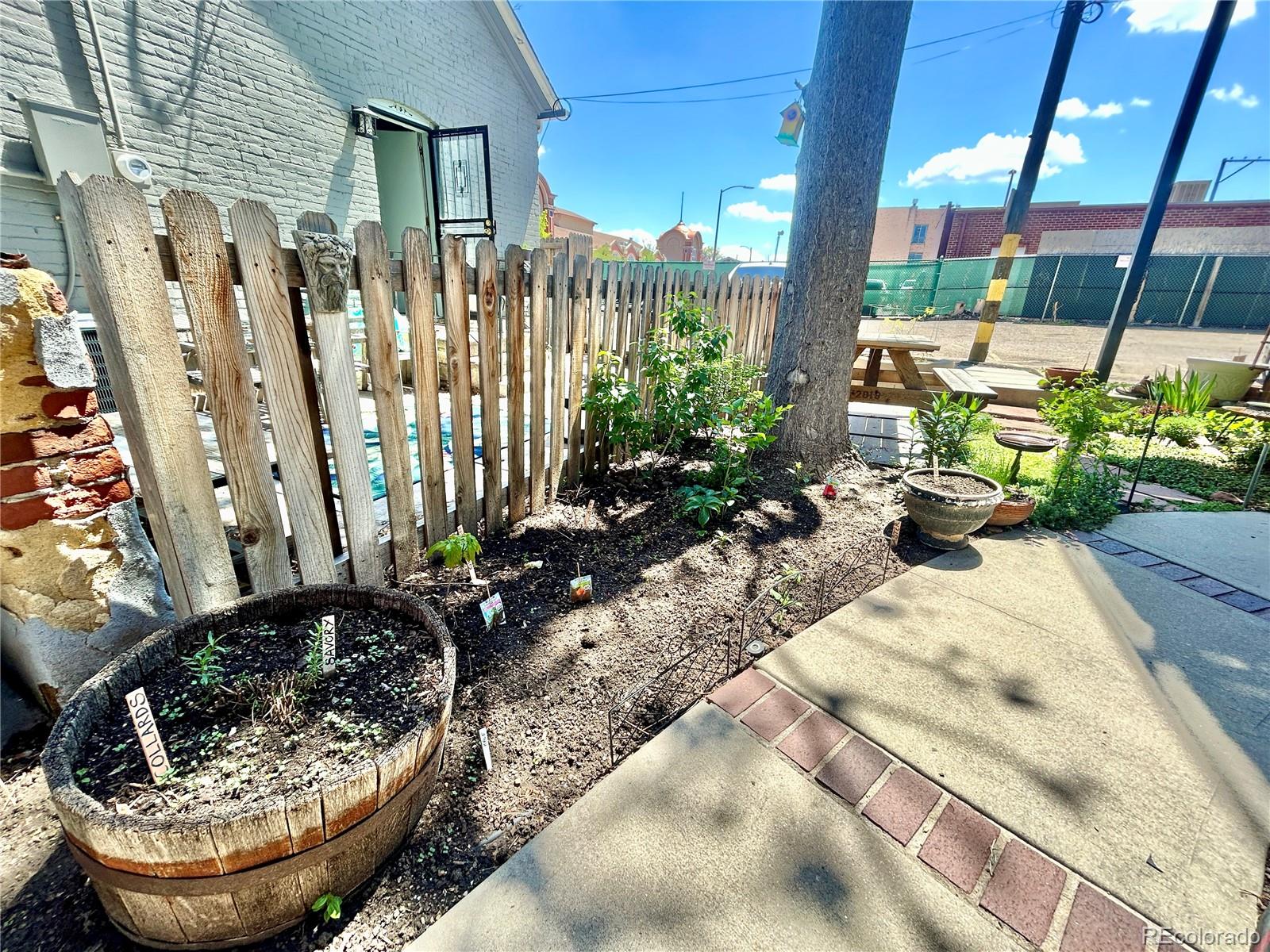 16-th 16-th E 16th Denver, CO 80203 - Photo 33 of 38 a view of two chairs in a patio