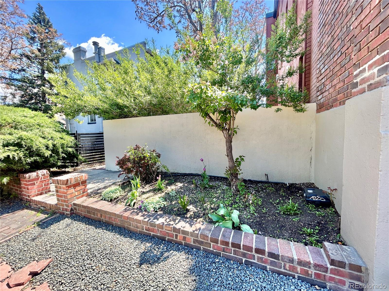 16-th 16-th E 16th Denver, CO 80203 - Photo 35 of 38 front view of a house with a yard