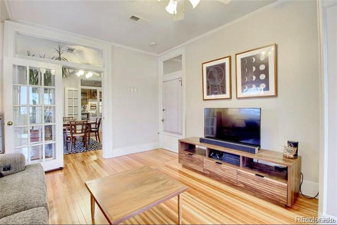 16-th 16-th E 16th Denver, CO 80203 - Photo 5 of 38 a living room with furniture and a flat screen tv