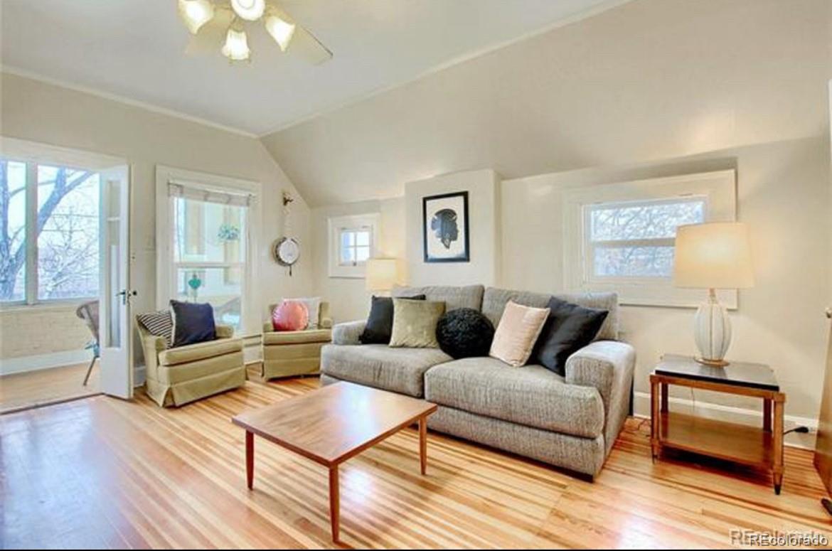 16-th 16-th E 16th Denver, CO 80203 - Photo 7 of 38 a living room with furniture and a wooden floor
