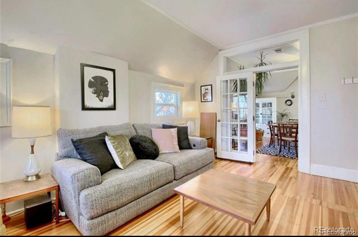 16-th 16-th E 16th Denver, CO 80203 - Photo 8 of 38 a living room with furniture and a wooden floor