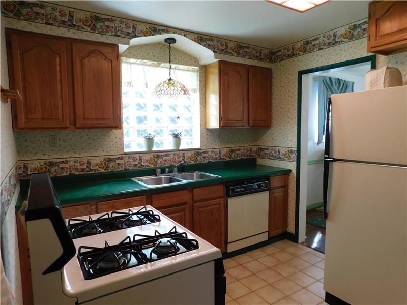 2367 Collins Road Pittsburgh, PA 15235 - Photo 9 of 25 Bright kitchen comes fully equipped with appliances and disposal.