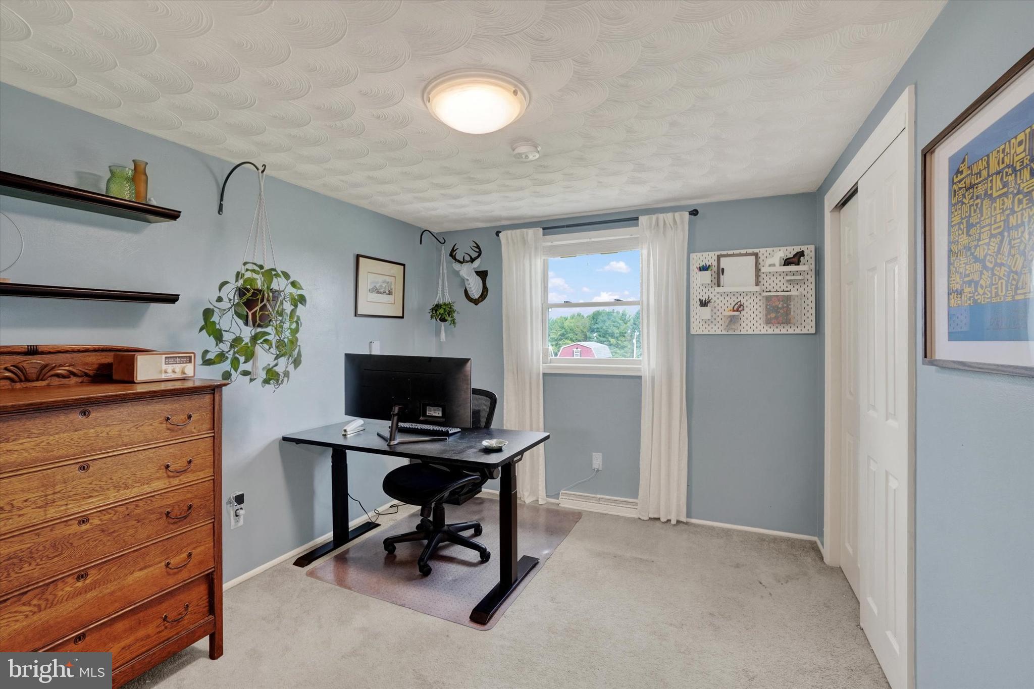 13174 Mont Road Felton, PA 17322 - Photo 34 of 39 a view of workspace with wooden floor windows cabinet