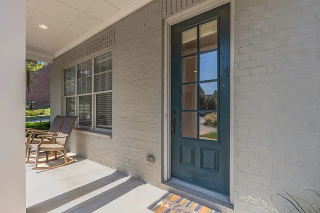 a view of backyard with a door and windows