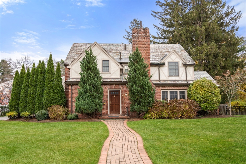 a front view of a house with garden