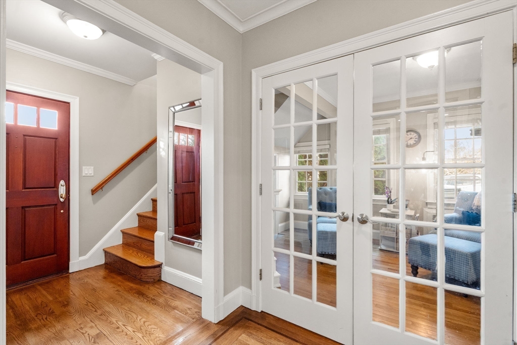 55 Evelyn Road Newton, MA 02468 - Photo 13 of 30 a view of an entryway with wooden floor and windows