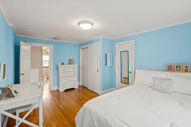 a bedroom with a bed and a television