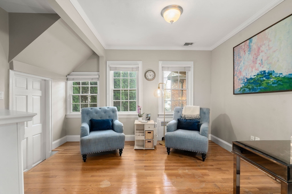 55 Evelyn Road Newton, MA 02468 - Photo 7 of 30 a living room with furniture and a large window